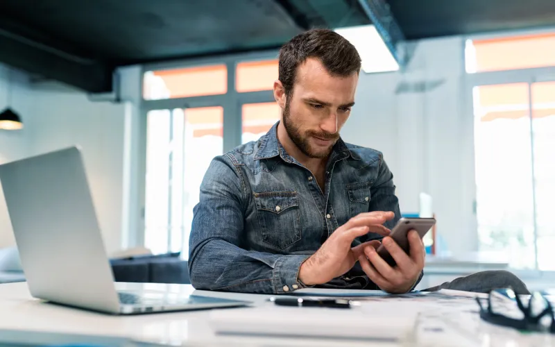 Business owner working on a calculator