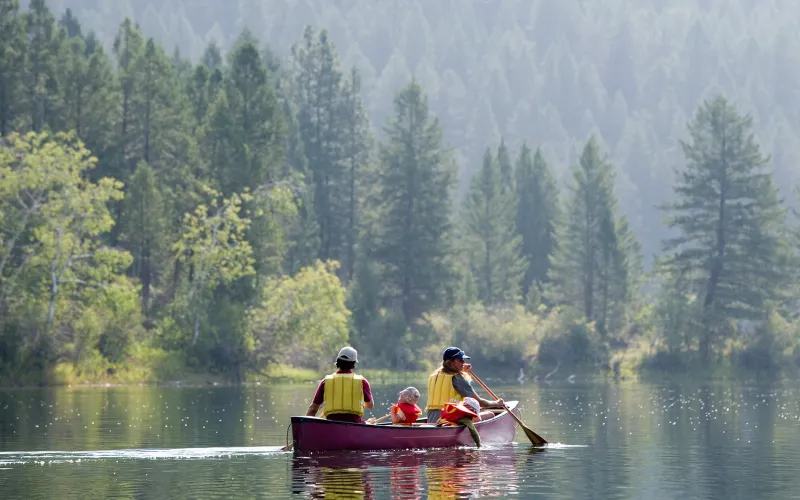 Family paddling in a canoe