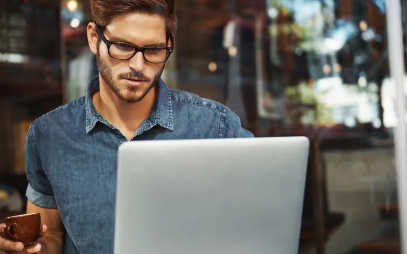 Man working on business finances on his laptop