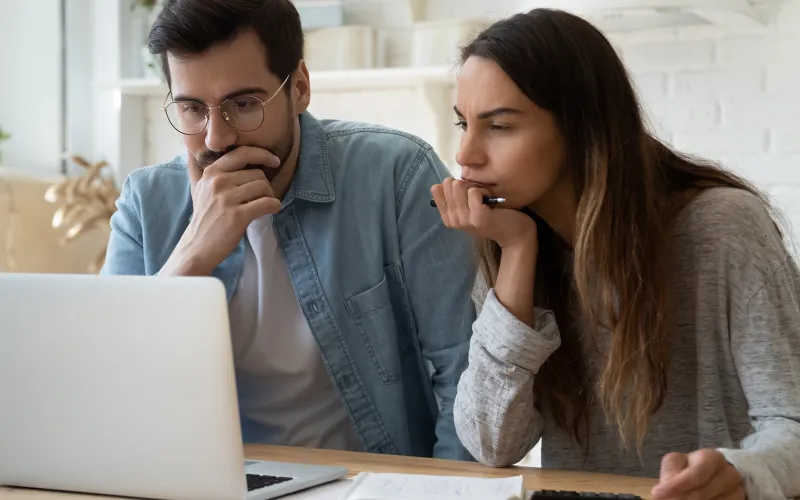 Couple looking at a laptop