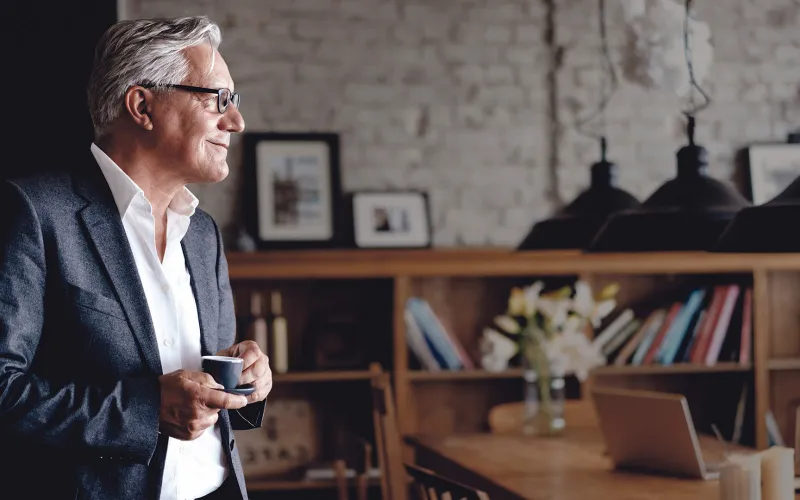 Business owner drinking coffee