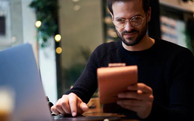 Business owner calculating his business expenses