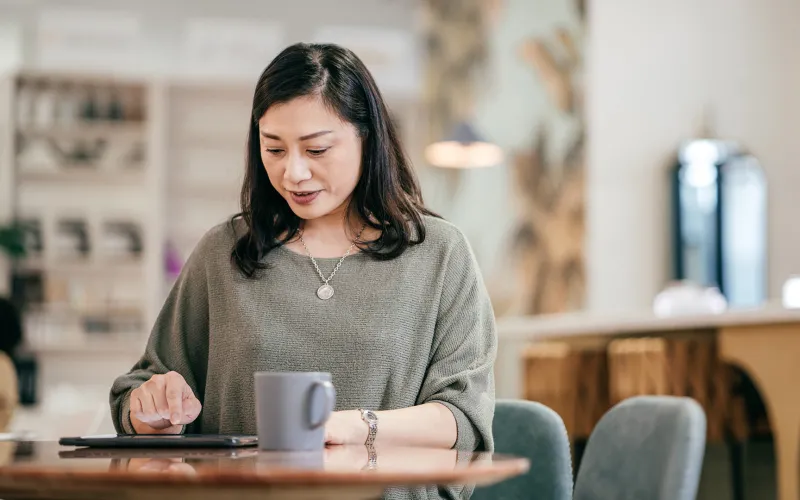 Woman working on her financial plan on tablet