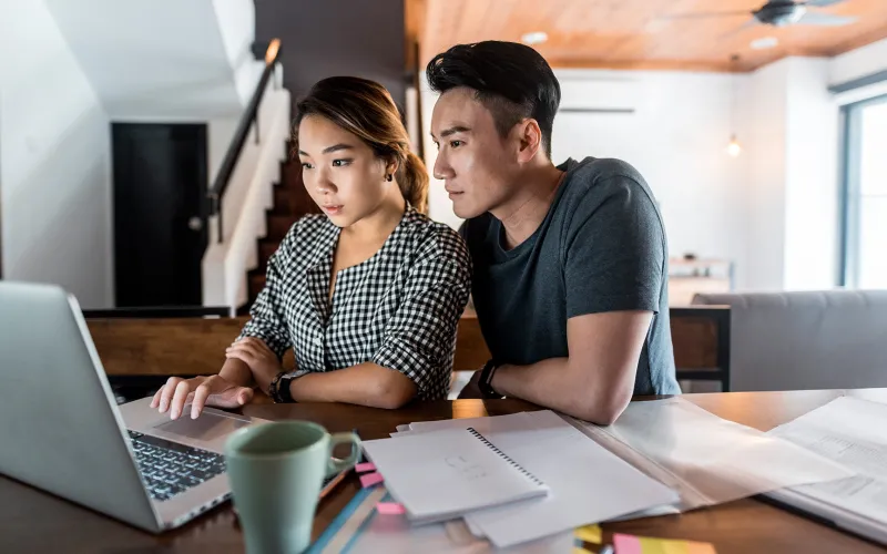 Couple planning on a laptop