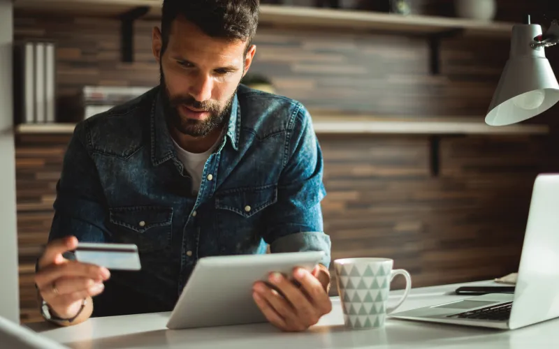Man making purchase on tablet