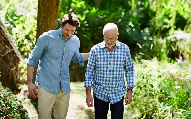 Father and son walking outside