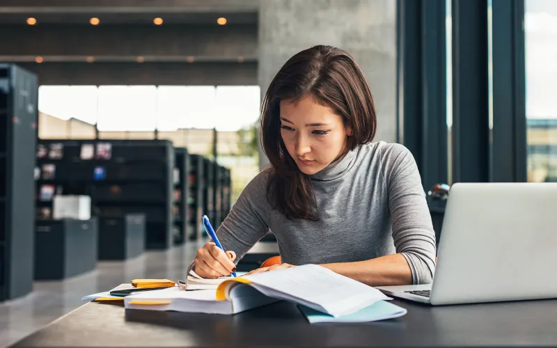 Lady working in library