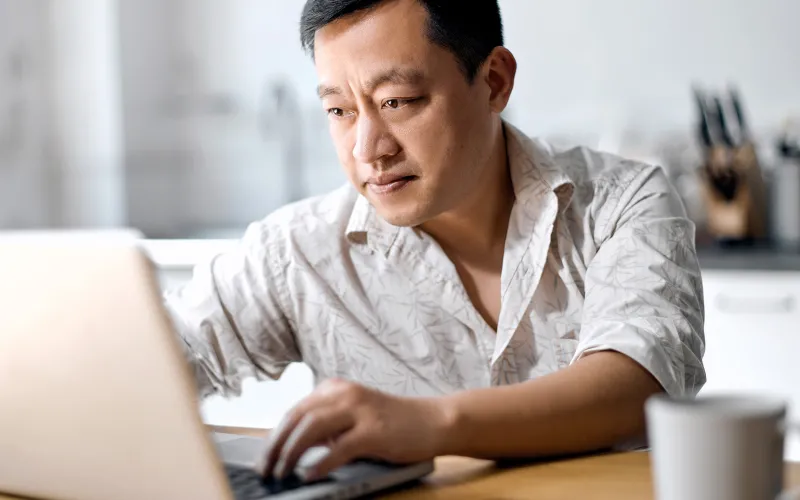 Man working on his investments on a computer