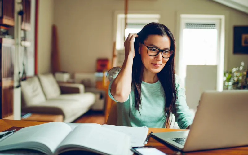 Woman at desk using laptop