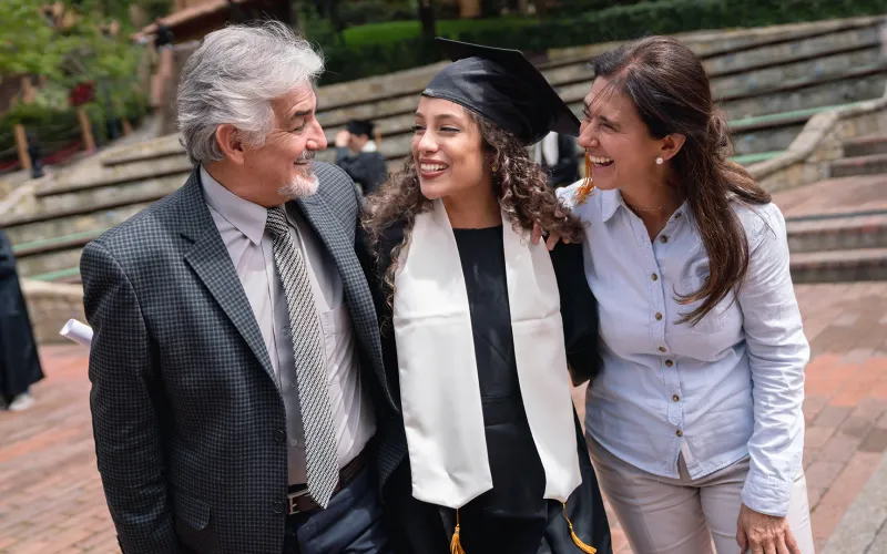 Woman at graduation with parents