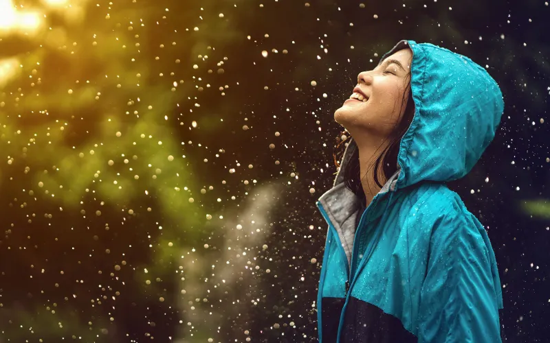 Woman standing in the rain