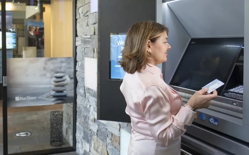 Woman using an ATM