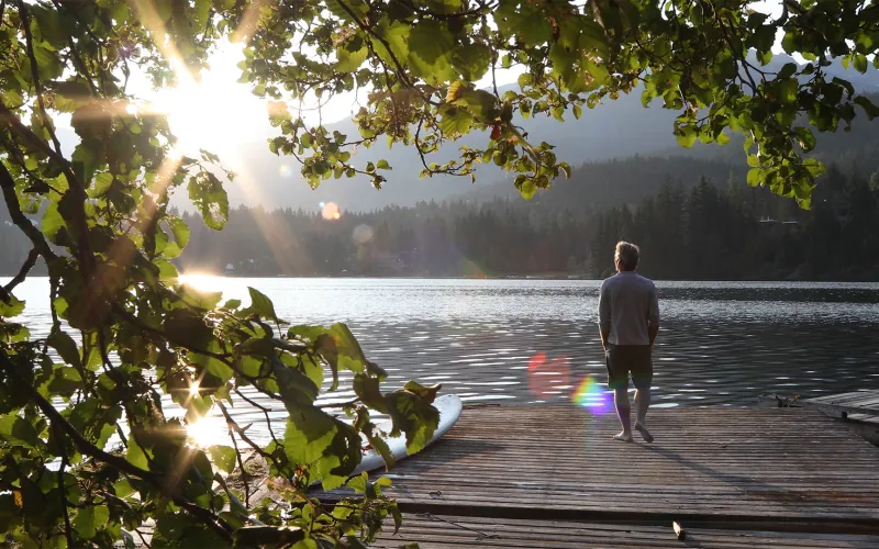 Man walking on pier 