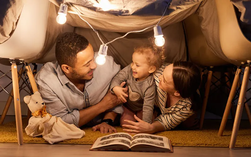 A family reading a book together