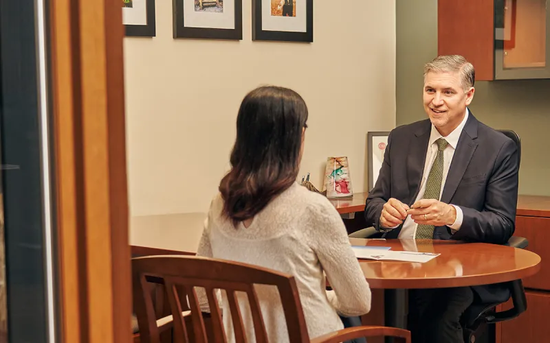 A client speaking with a financial advisor at BlueShore Financial Credit Union.