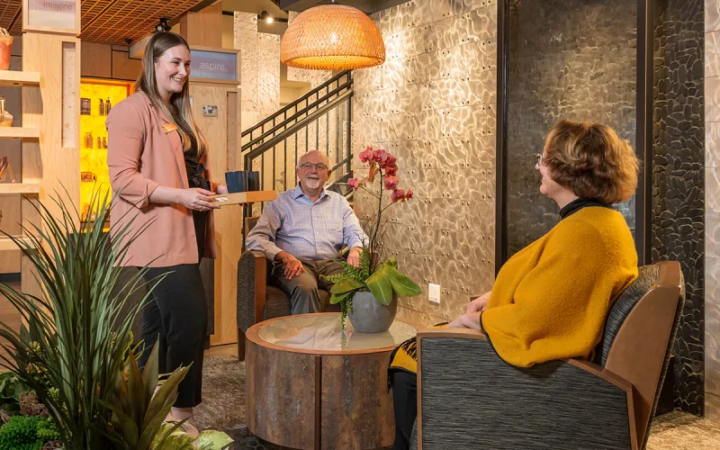 A concierge greeting clients at a BlueShore Financial branch.