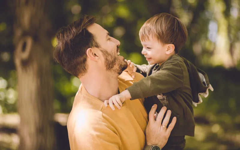 A Father and son laughing with each other