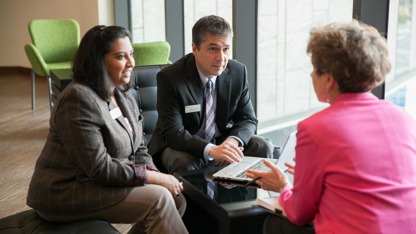 Advisors discussing options for retirement with client