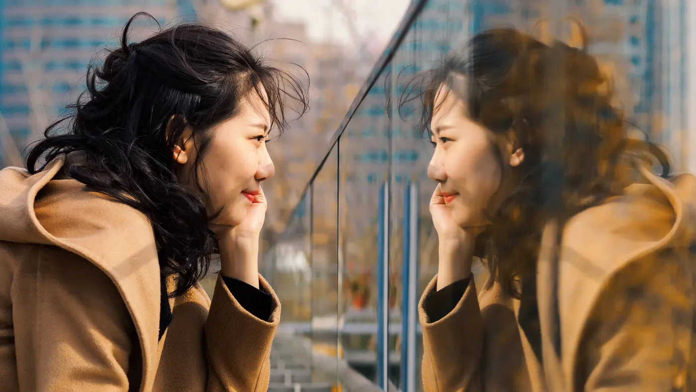Woman looking in the mirror