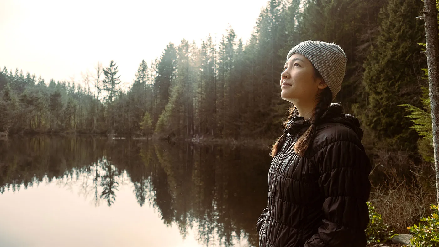Woman beside lake