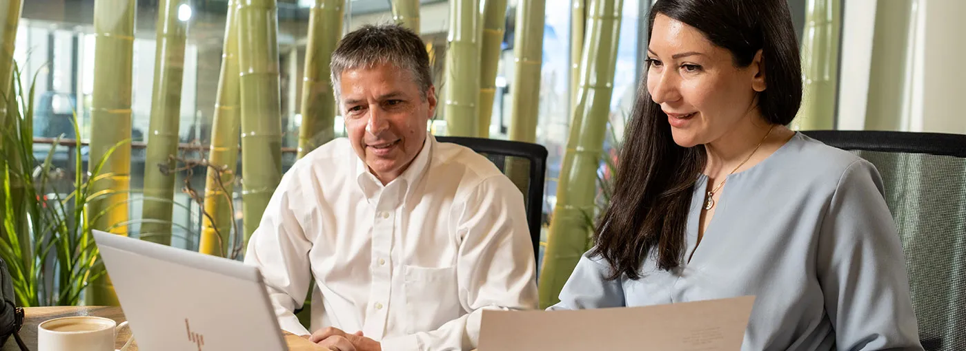 Business advisor speaking with a client in a BlueShore Financial branch