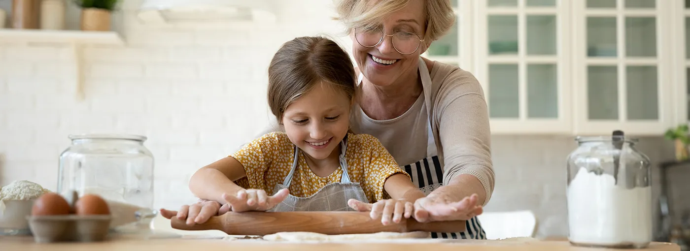 Grandmother baking with her granddaughter