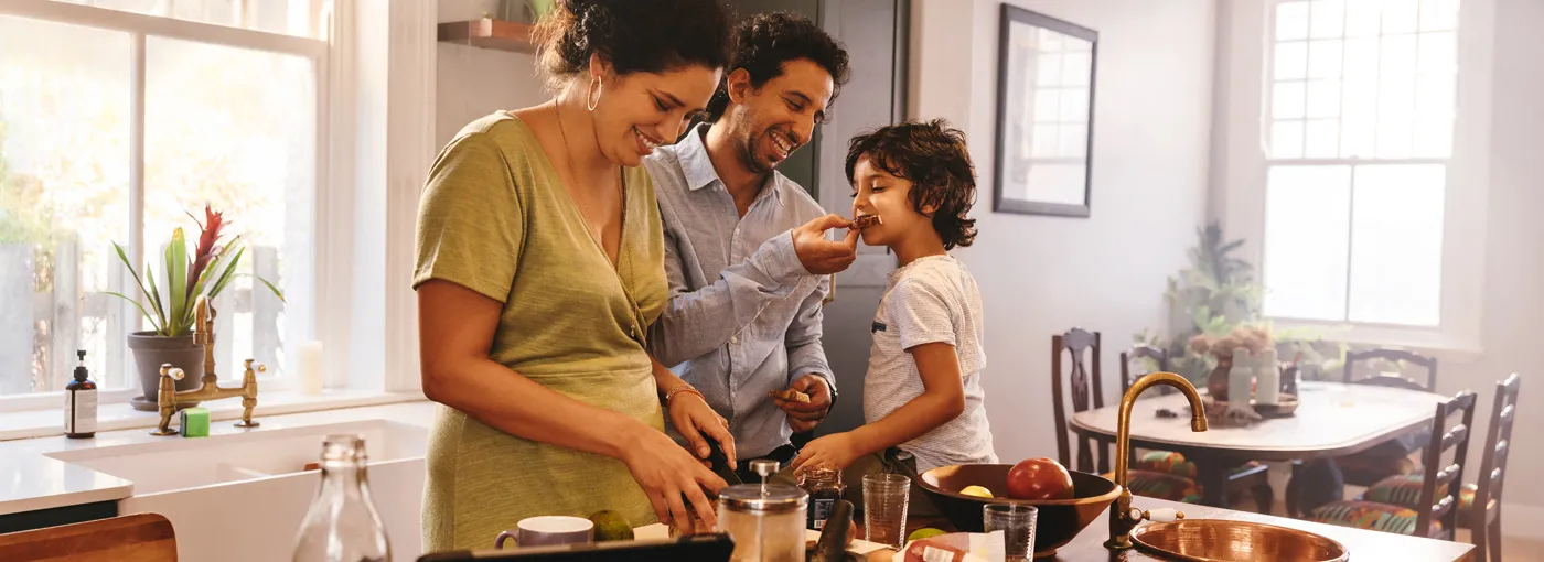 A family cooking together in the kitchen