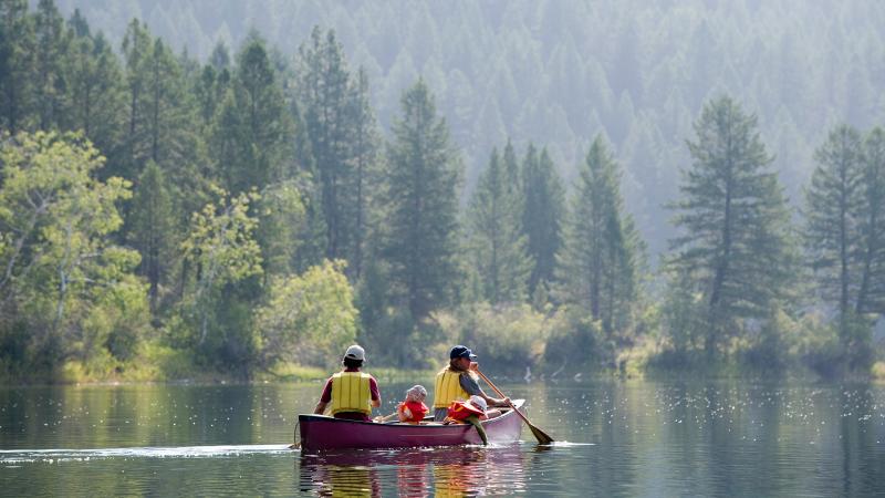 Family paddling in a canoe