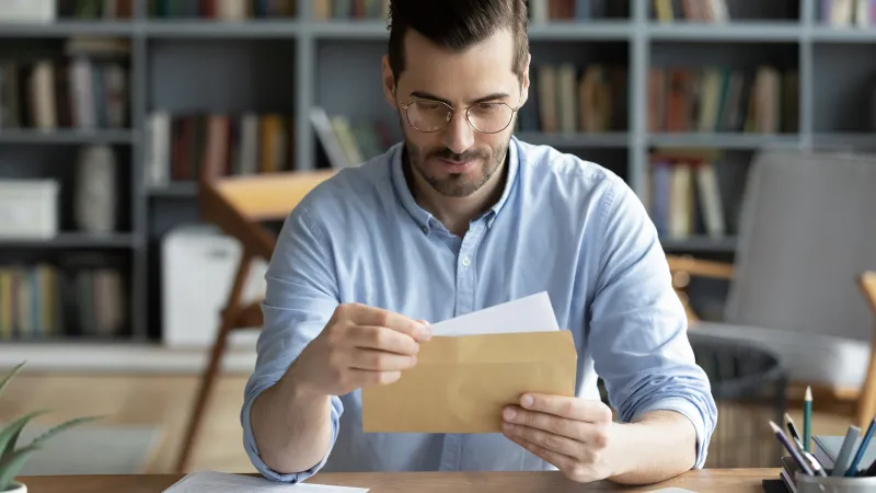 Man looking at his account statement
