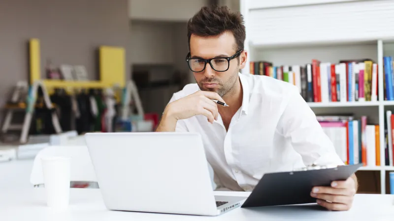 Business owner working on computer in office
