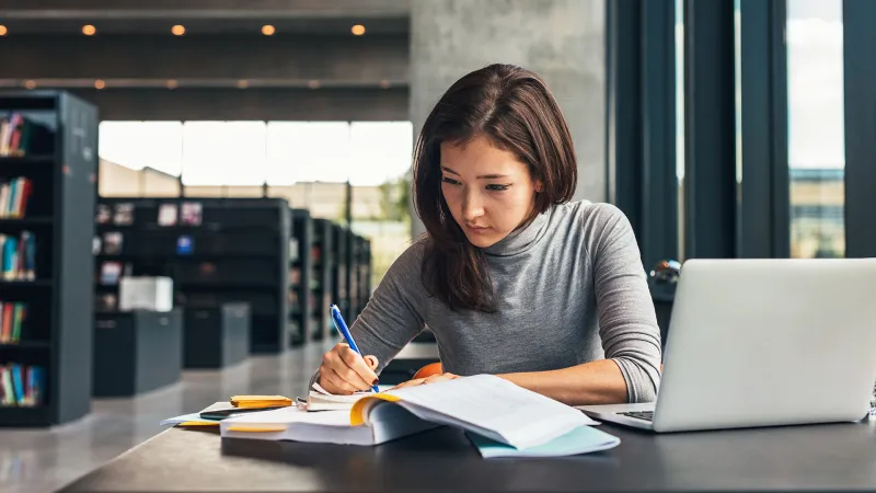 Woman studying in the library