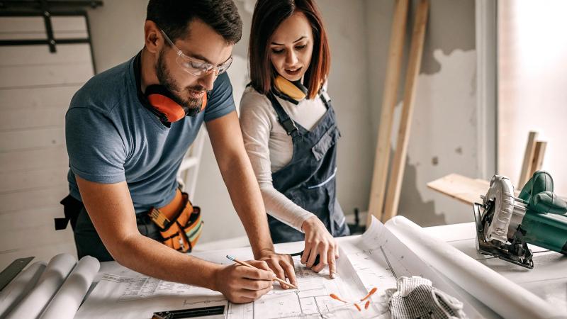 Couple working on renovation plans