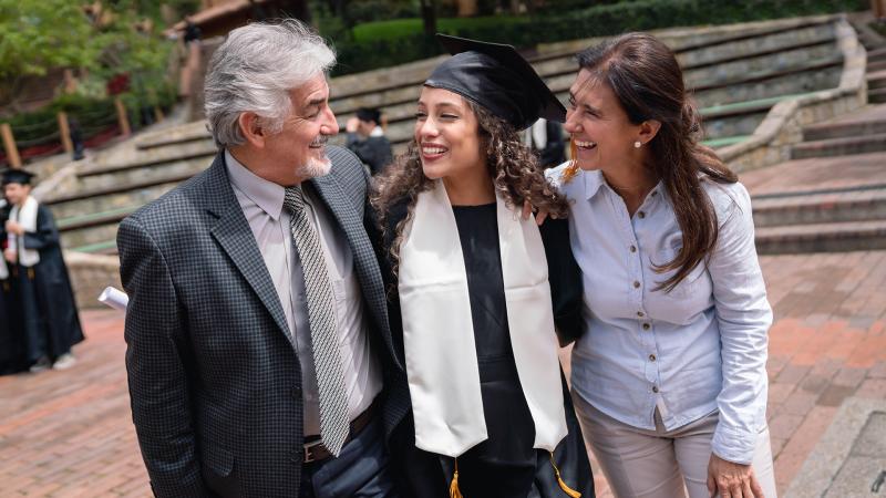 Woman at graduation with parents