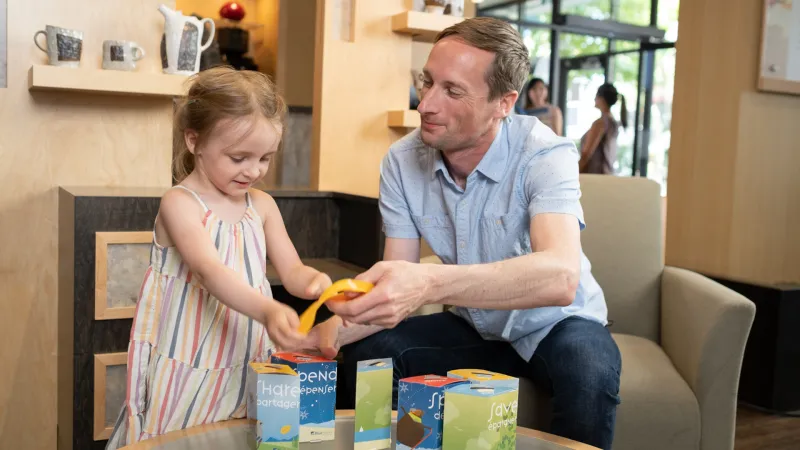 Father helping daughter with Wishbank