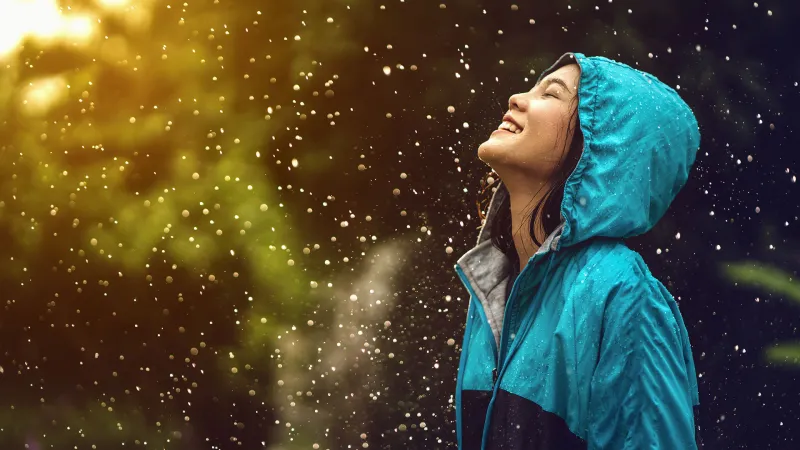 Woman standing in rain