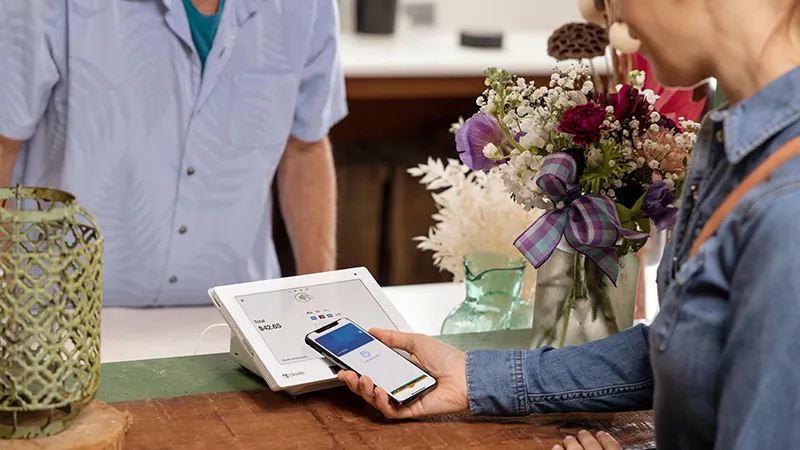 A customer using a contactless payment system.